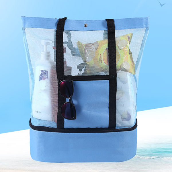 Blue mesh beach tote packed with sunscreen, sunglasses, and beach snacks