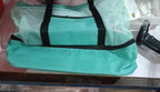 Close-up of mint green insulated cooler bottom compartment fabric